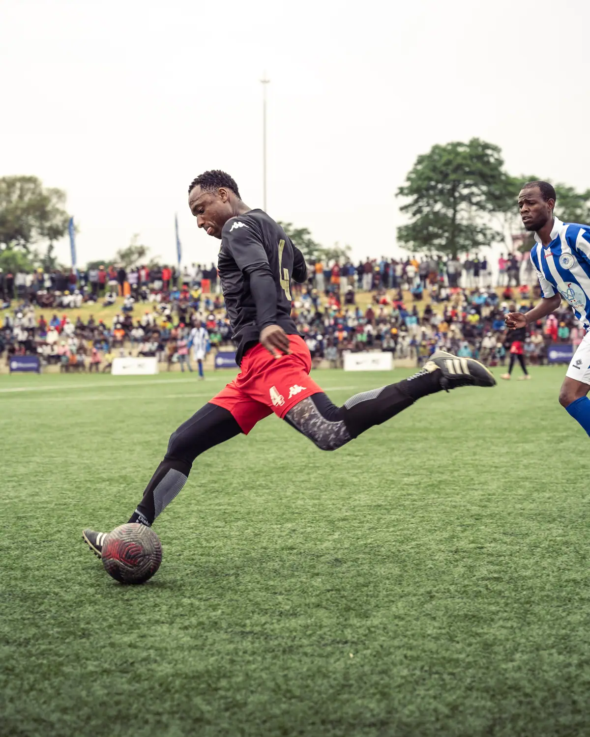DWSSC player striking the ball during a league match