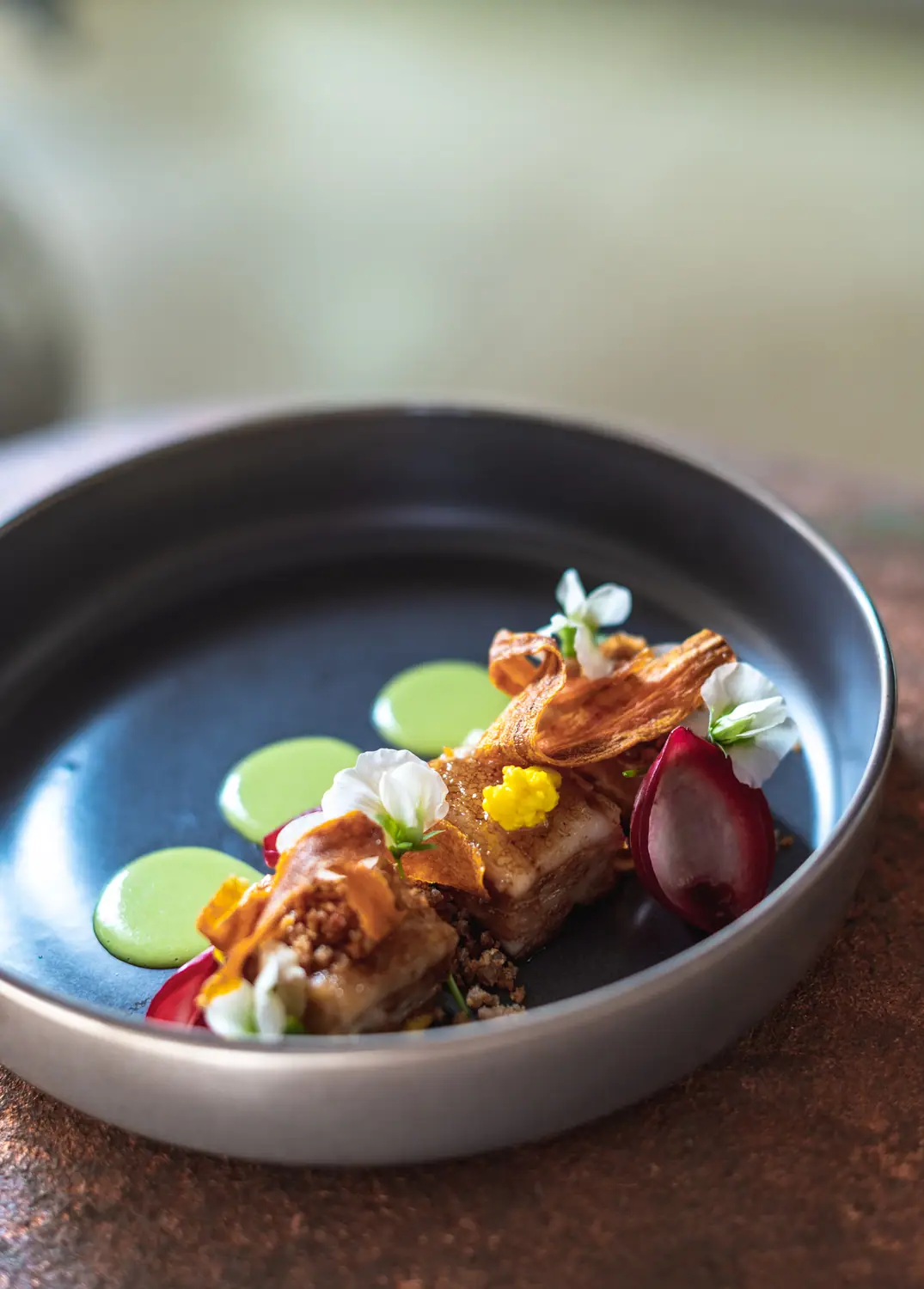 Culture Club — plated course with herb oil and micro garnish