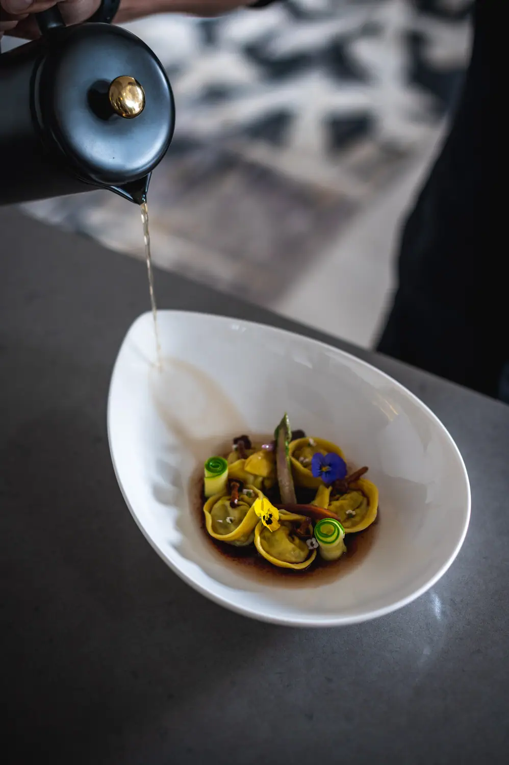Culture Club — broth poured over the dish at the pass