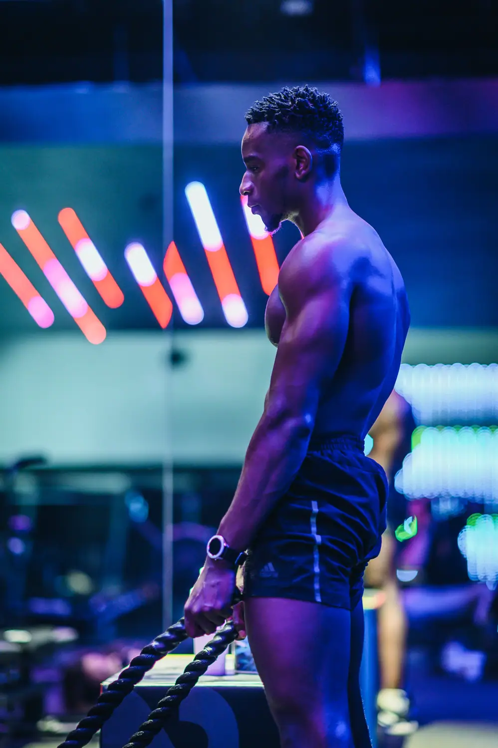 MetaLab athlete lit in neon during a gym campaign shoot