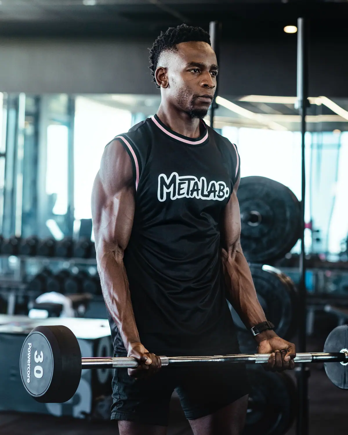 MetaLab athlete at the barbell in a daylit gym