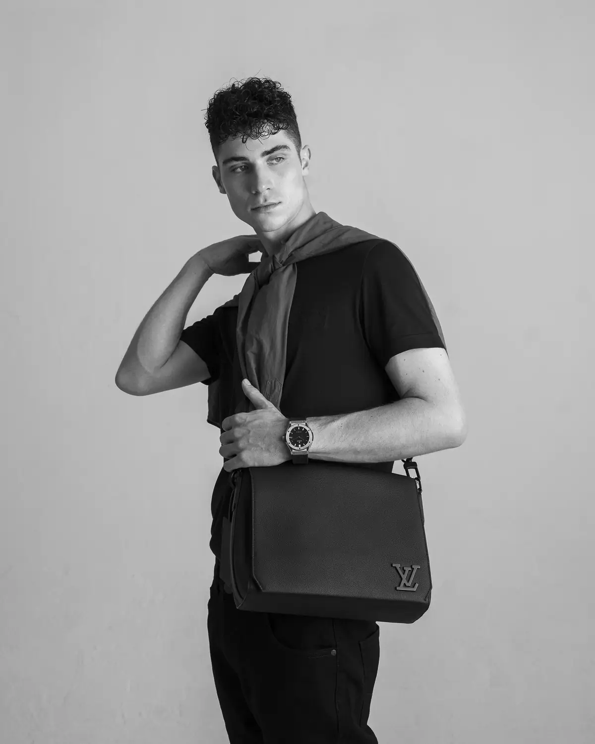 Luxity studio portrait with a designer shoulder bag