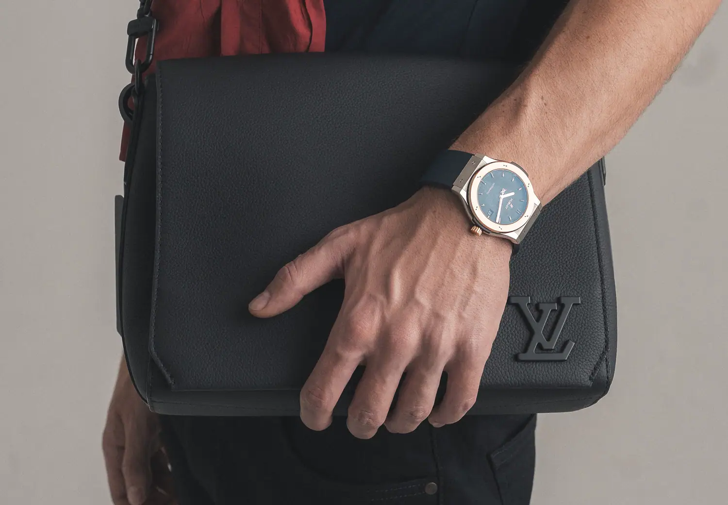 Luxity product detail — bag and watch carried in hand