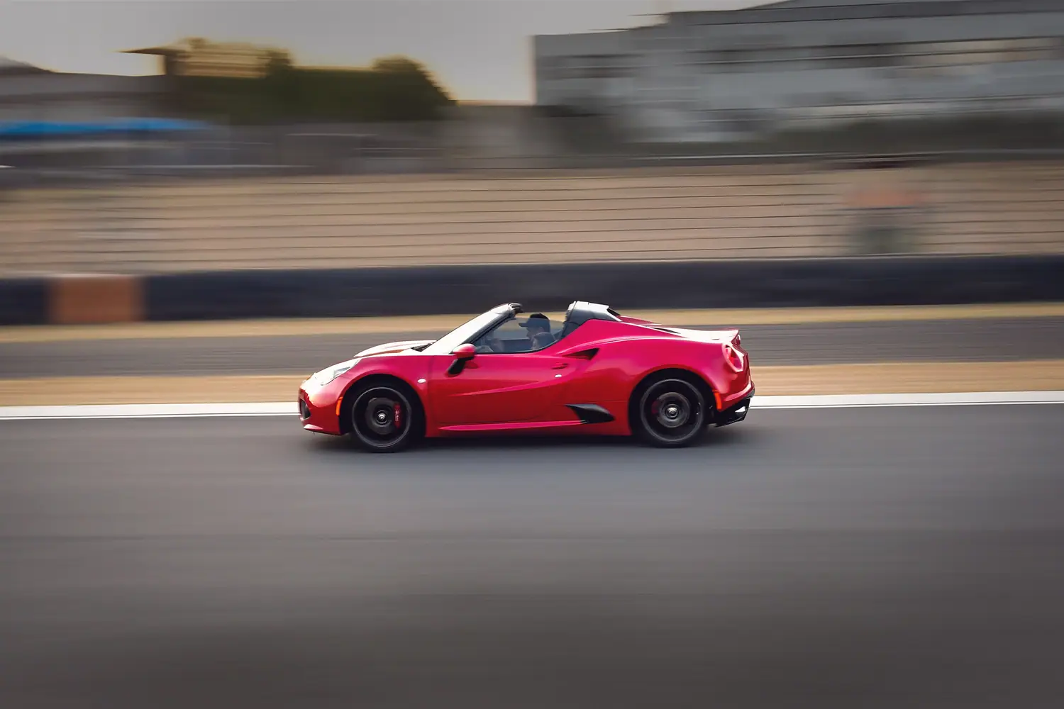 Red Alfa Romeo 4C panned at speed