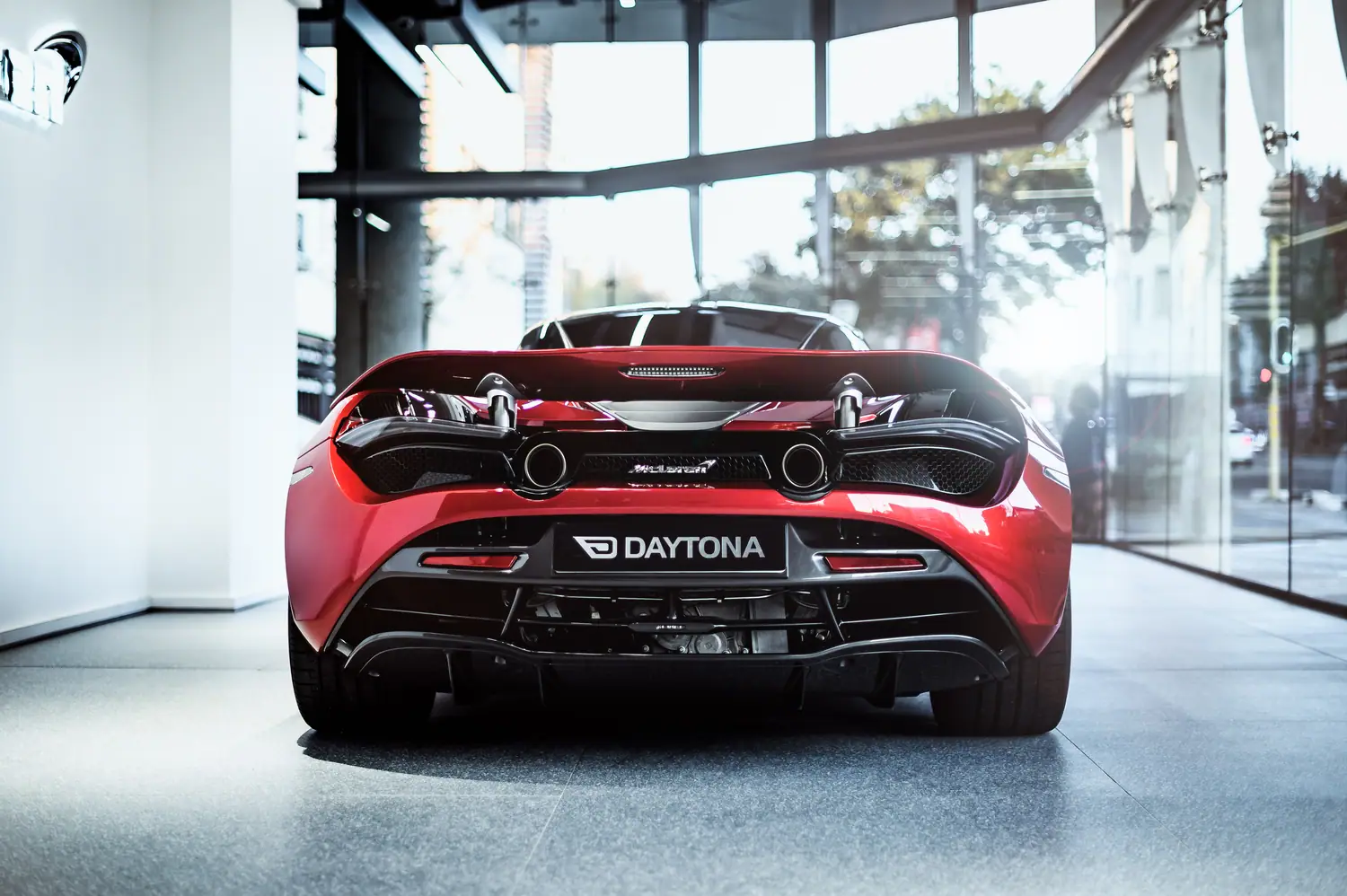 McLaren 720S Daytona rear quarter in a glass showroom